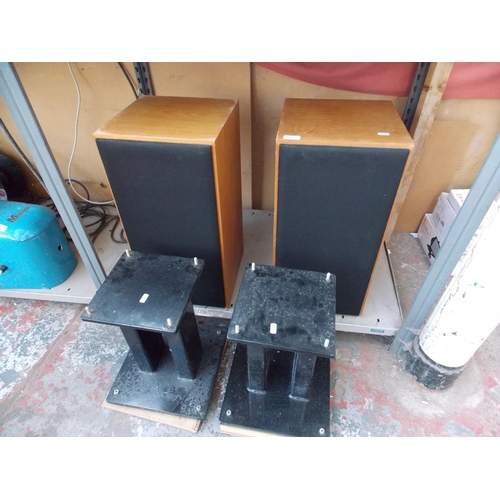 218 - A PAIR OF VINTAGE WOOD EFFECT SPEAKERS ON HEAVY DUTY STANDS