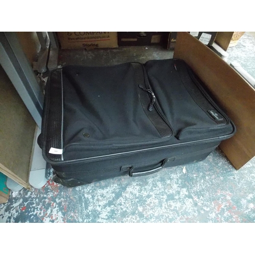 247 - A SAMSONITE SUITCASE CONTAINING A HUGO BOSS DUFFLE BAG AND A LARGE TRAVEL CASE