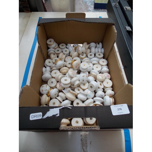 278 - A BOX CONTAINING A LARGE QUANTITY OF CERAMIC DOOR HANDLES