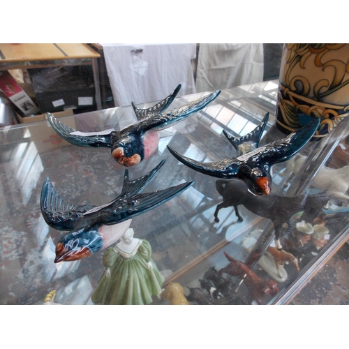 293 - THREE BESWICK SWALLOWS