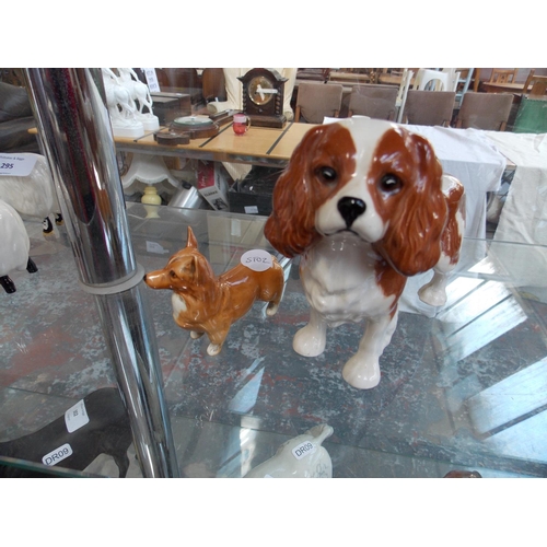 296 - A BESWICK KING CHARLES SPANIEL AND A BESWICK CORGI