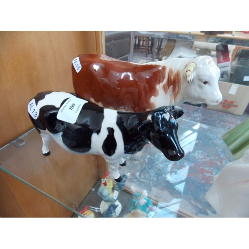 299 - A BESWICK BULL AND A BESWICK COW