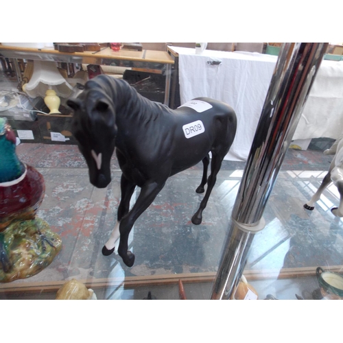 302 - A ROYAL DOULTON BISQUE BLACK HORSE