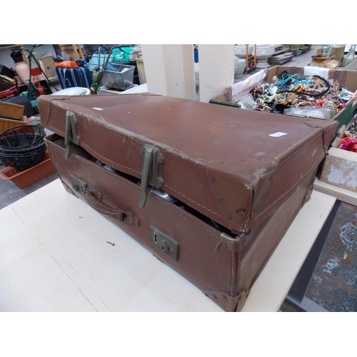 349 - A VINTAGE LEATHER SUITCASE CONTAINING SILVER PLATED ITEMS, BRASS BELL, VINTAGE WEIGHT SCALES ETC