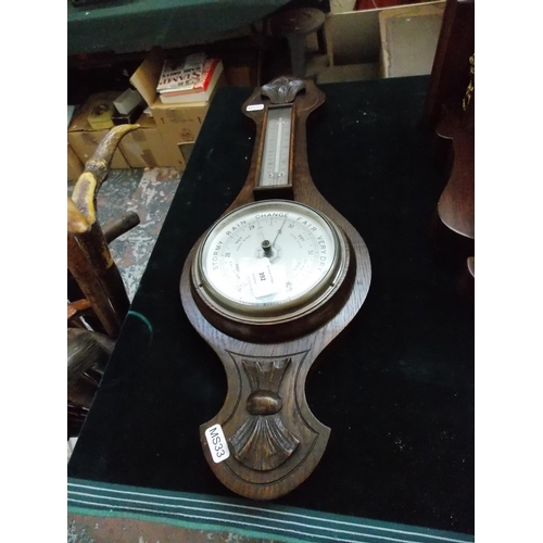 392 - A VINTAGE OAK BAROMETER