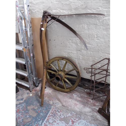 83 - THREE ITEMS TO INCLUDE TWO VINTAGE WOODEN SCYTHES AND A CARTWHEEL