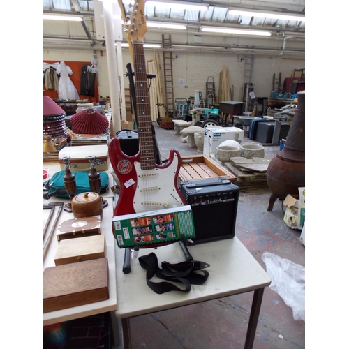 376 - A STAGG ELECTRIC GUITAR WITH A BB BLASTER AMPLIFIER AND GUITAR BOOKLET (STAND NOT INCLUDED)