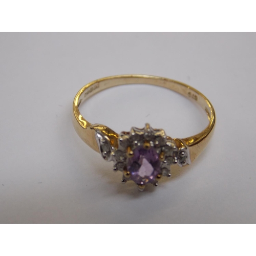 479 - A 9 CARAT GOLD AMETHYST AND DIAMOND RING - SIZE N