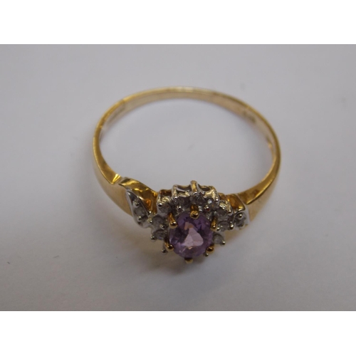 479 - A 9 CARAT GOLD AMETHYST AND DIAMOND RING - SIZE N