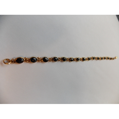 489 - A 15 CARAT GOLD SAPPHIRE 8 INCH BRACELET (TESTED BY VENDOR)