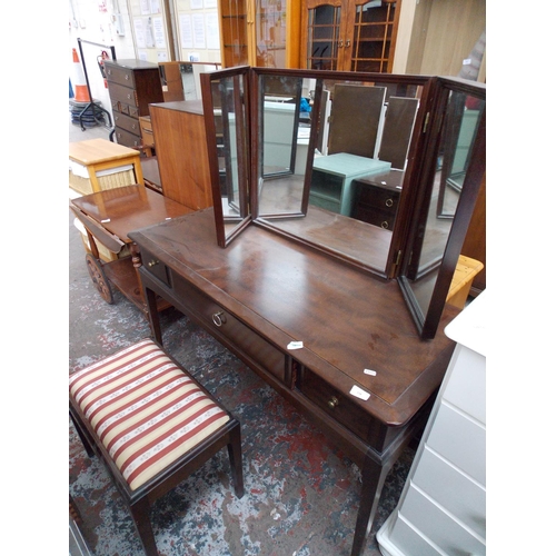 535 - A STAG MAHOGANY DRESSING TABLE WITH THREE DRAWERS, THREE SECTIONED MIRROR AND A DRESSING TABLE STOOL