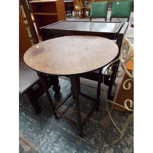 566 - A WROUGHT IRON GLASS TOPPED HALL TABLE AND A ROUND MAHOGANY TABLE