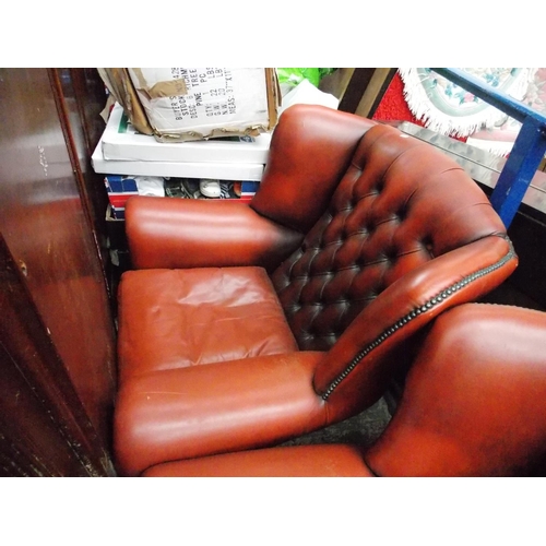 618 - AN OXBLOOD CHESTERFIELD SOFA AND TWO MATCHING ARMCHAIRS