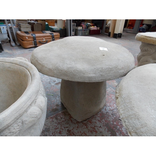 151 - A LARGE RECONSTITUTED STONE TOADSTOOL GARDEN ORNAMENT