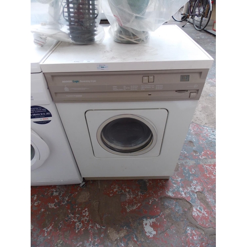 188 - A HOOVER LOGIC REVERSING TUMBLE DRYER IN W/O