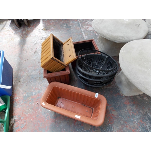 150 - EIGHT ITEMS TO INCLUDE WOODEN GARDEN PLANTERS, HANGING BASKETS ETC