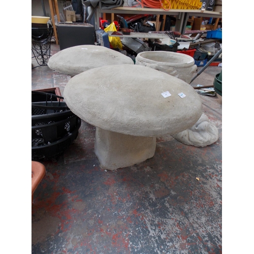 151 - A LARGE RECONSTITUTED STONE TOADSTOOL GARDEN ORNAMENT