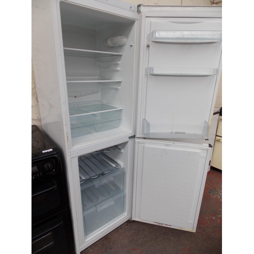 172 - A BOSCH CLASSIXX UPRIGHT FRIDGE FREEZER IN W/O