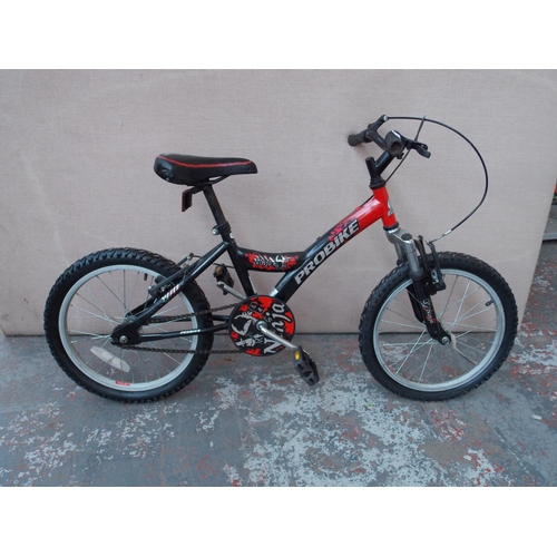 20 - A BLACK AND RED PRO BIKE NINJA BMX STYLE BIKE WITH FRONT SUSPENSION