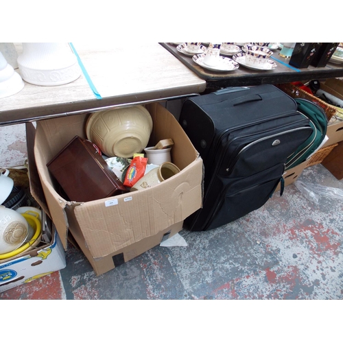 224 - FOUR BOXES CONTAINING GLASSWARE, CHINA, CLOCKS, CUTLERY, WICKER BASKET ETC AND A SUITCASE CONTAINING... 