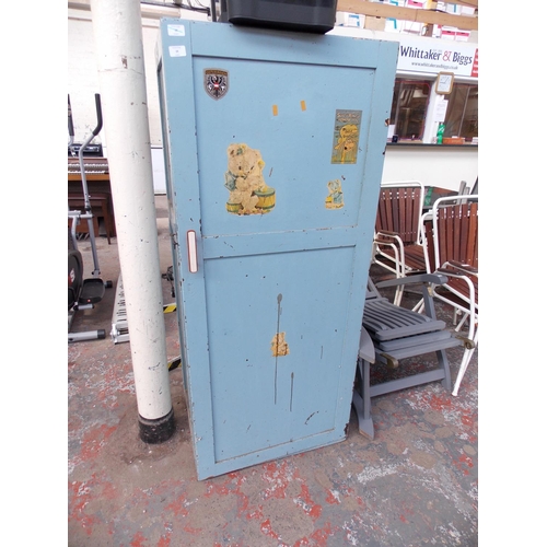 24 - A BLUE PAINTED VINTAGE WOODEN STORAGE CABINET