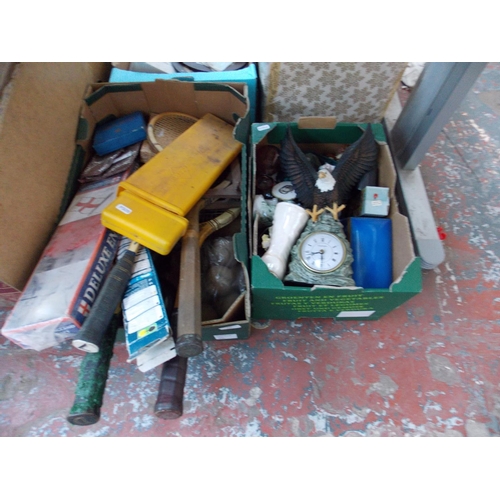 264 - TWO BOXES CONTAINING CLOCKS, GLASSWARE, TENNIS RACKETS ETC