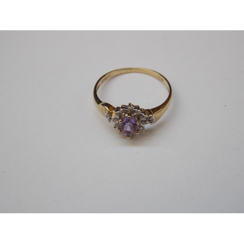 479 - A 9 CARAT GOLD AMETHYST AND DIAMOND RING - SIZE N