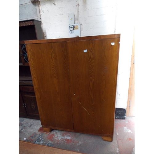 532 - FOUR ITEMS - AN OAK FITTED WARDROBE,A DARK OAK DRESSER WITH TWO UPPER GLAZED DOORS, THREE LOWER DOOR... 