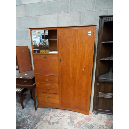 534 - AN OAK SINGLE WARDROBE WITH THREE DRAWERS, MIRRORED GLASS DOORS AND A FALL FRONT