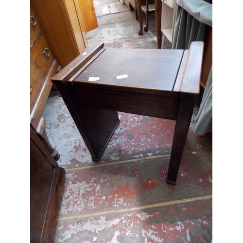 550 - AN ART DECO PIANO STOOL AND A TWO TIER DUMBWAITER