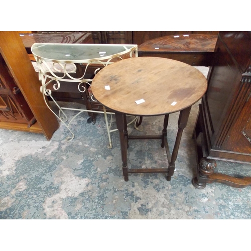 566 - A WROUGHT IRON GLASS TOPPED HALL TABLE AND A ROUND MAHOGANY TABLE