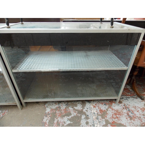 584 - A PAIR OF GLASS COUNTER DISPLAY CABINETS