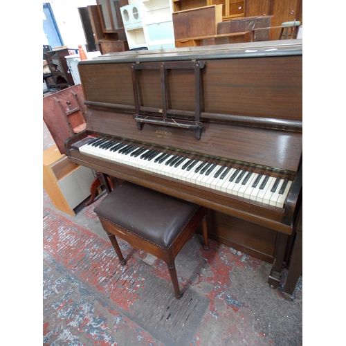 601 - A KIRKMAN UPRIGHT PIANO AND A STOOL