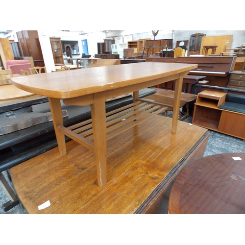 649 - A GOLDEN OAK DROP LEAF DINING TABLE AND A TEAK COFFEE TABLE