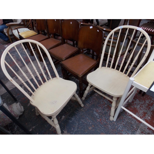 671 - A PAIR OF CREAM PAINTED KITCHEN CHAIRS