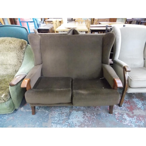 674 - A PAIR OF BEIGE UPHOLSTERED WINGBACK CHAIRS