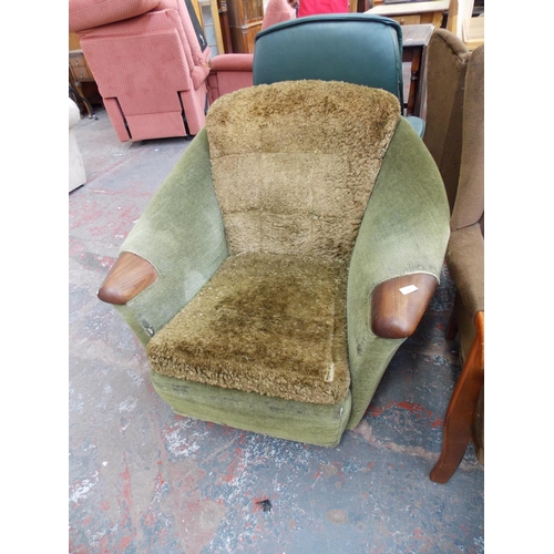 675 - A 1970'S GREEN DRALON ARM CHAIR