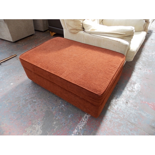 680 - AN ORANGE UPHOLSTERED LIDDED POUFFET