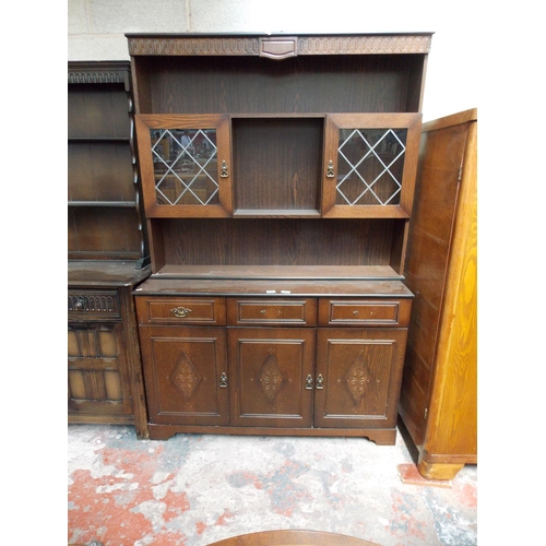 532 - FOUR ITEMS - AN OAK FITTED WARDROBE,A DARK OAK DRESSER WITH TWO UPPER GLAZED DOORS, THREE LOWER DOOR... 