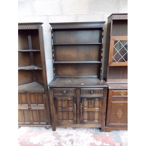 532 - FOUR ITEMS - AN OAK FITTED WARDROBE,A DARK OAK DRESSER WITH TWO UPPER GLAZED DOORS, THREE LOWER DOOR... 