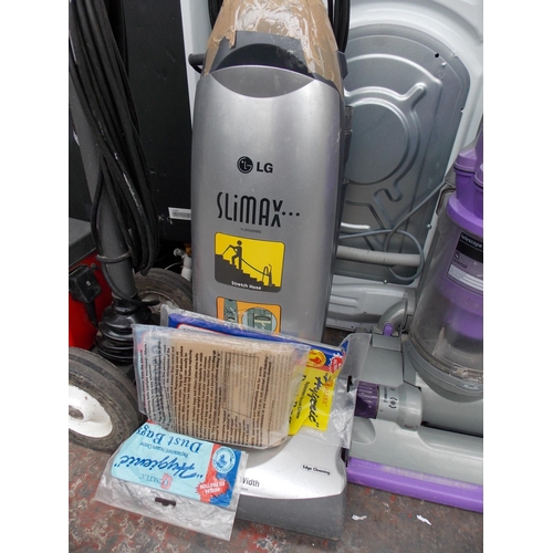 213 - AN LG SLIMAX UPRIGHT VACUUM CLEANER WITH SPARE BAGS