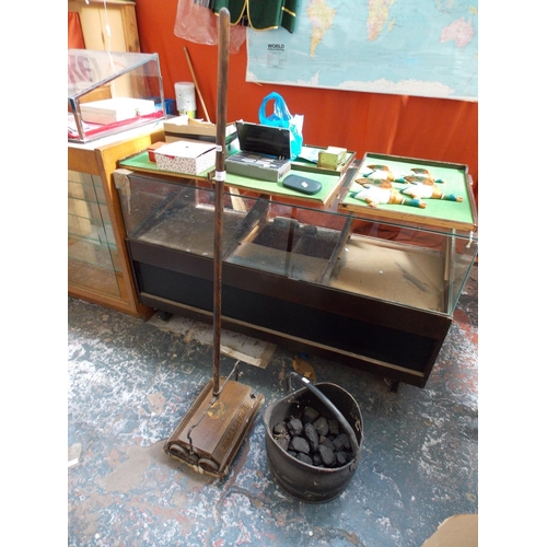 253 - TWO ITEMS TO INCLUDE A EWBANK EMPIRE 1930'S HOOVER AND A CAST METAL COAL SCUTTLE