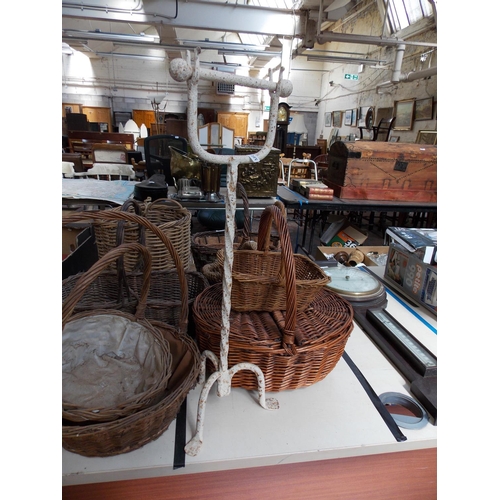 308 - NINE VARIOUS SIZED WICKER BASKETS AMD A VINTAGE WROUGHT IRON TOILET HOLDER