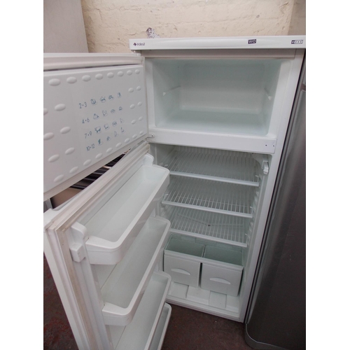 185 - AN INDESIT UPRIGHT FRIDGE FREEZER IN W/O