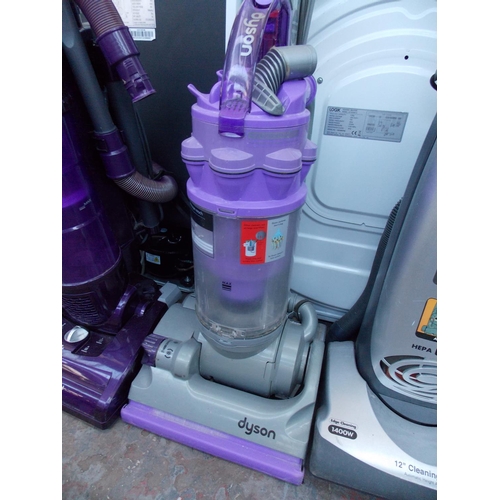 214 - A PURPLE AND GREY DYSON UPRIGHT BAGLESS VACUUM CLEANER IN W/O