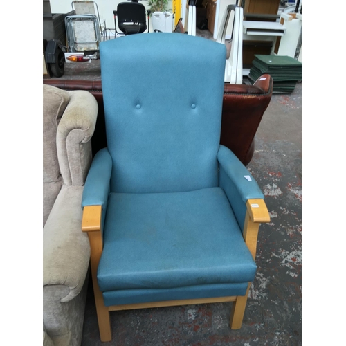 679 - A BLUE LEATHERETTE OCCASIONAL CHAIR AND A BEECH FRAMED CREAM UPHOLSTERED WINGBACK ARM CHAIR