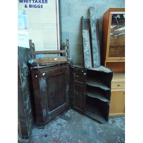 545 - A GEORGIAN OAK CORNER CABINET IN NEED OF REPAIR TOGETHER WITH A GEORGIAN OAK WALL CORNER CABINET AND... 