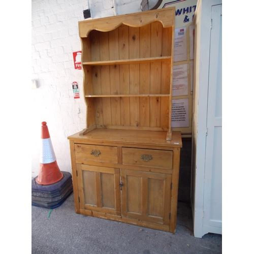 548 - A PINE DRESSER WITH TWO LOWER DOORS, TWO DRAWERS AND AN UPPER PLATE RACK