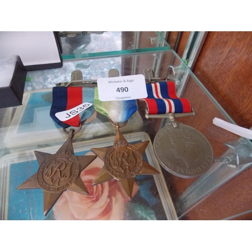 490 - THREE WORLD WAR 2 MEDALS TO INCLUDE THE ATLANTIC STAR, THE 1939-45 STAR AND A 1939-45 MEDAL