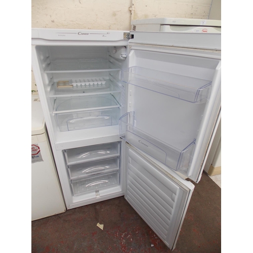 106 - A CANDY UPRIGHT FRIDGE FREEZER (W/O)